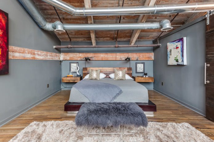 quarto em estilo industrial com comunicações abertas