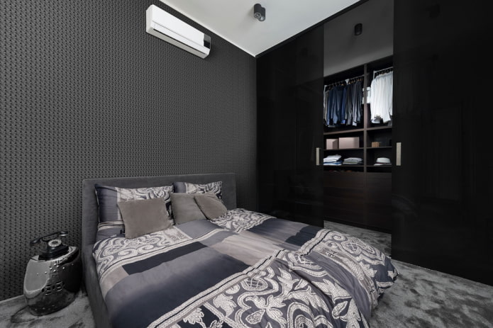 móveis no interior do quarto em tons de preto