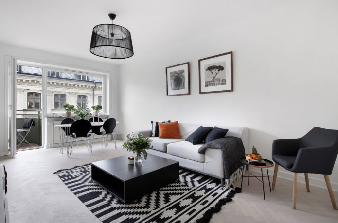 iluminação e decoração na sala de estar em tons de preto e branco