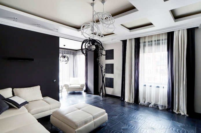 móveis e tecidos na sala de estar em tons de preto e branco