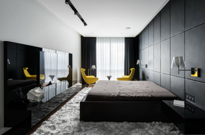 móveis no interior do quarto em tons de preto e branco