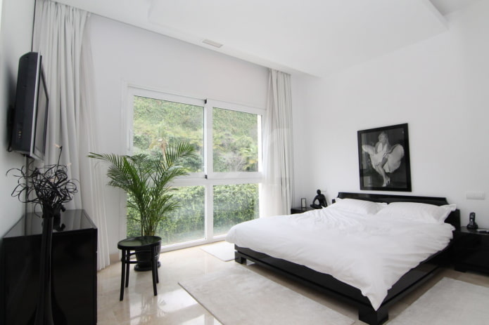 decoração e iluminação de quarto em preto e branco