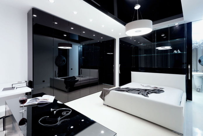 móveis no interior do quarto em tons de preto e branco