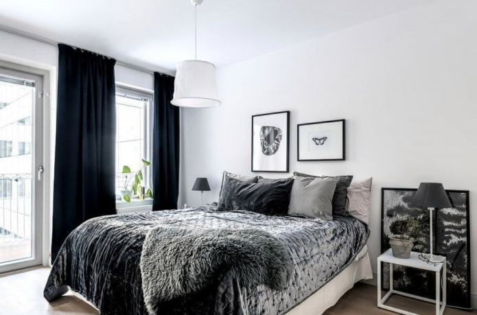 têxteis no interior do quarto em tons de preto e branco