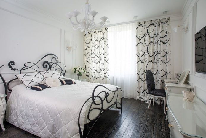 móveis no interior do quarto em tons de preto e branco