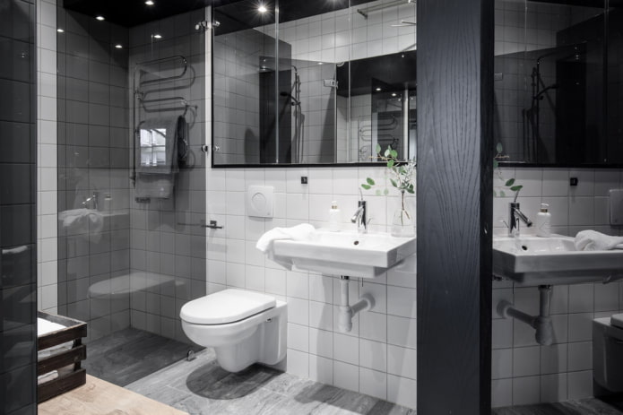 Azulejos brancos e um teto preto brilhante