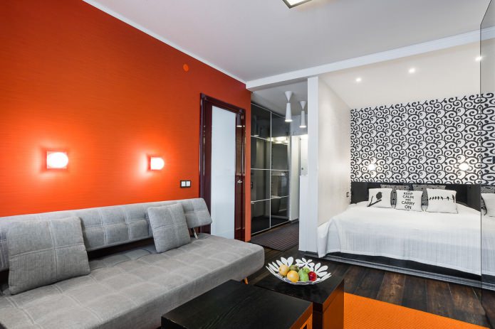 sala de estar e quarto no interior de um apartamento de um cômodo em estilo moderno
