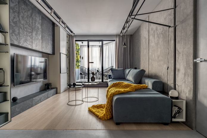 Sala de estar cinza com um cobertor brilhante
