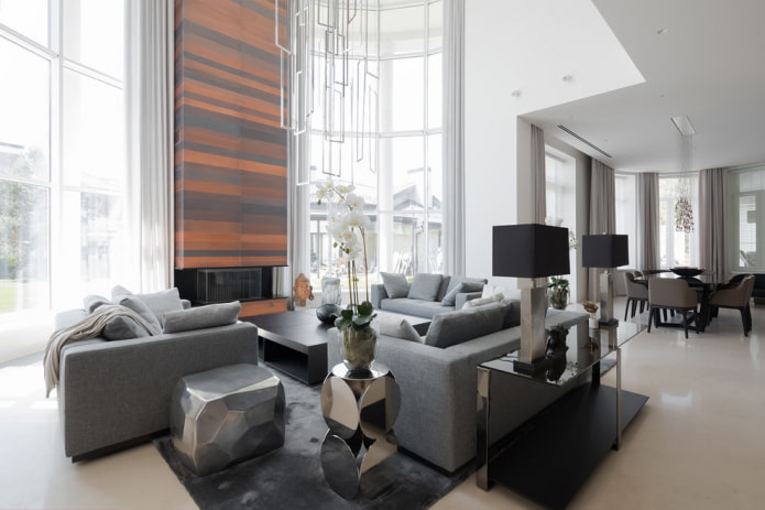 sala de estar com um conjunto de sofás cinza