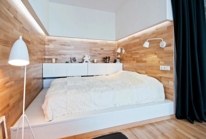 cama em um pódio monolítico no interior
