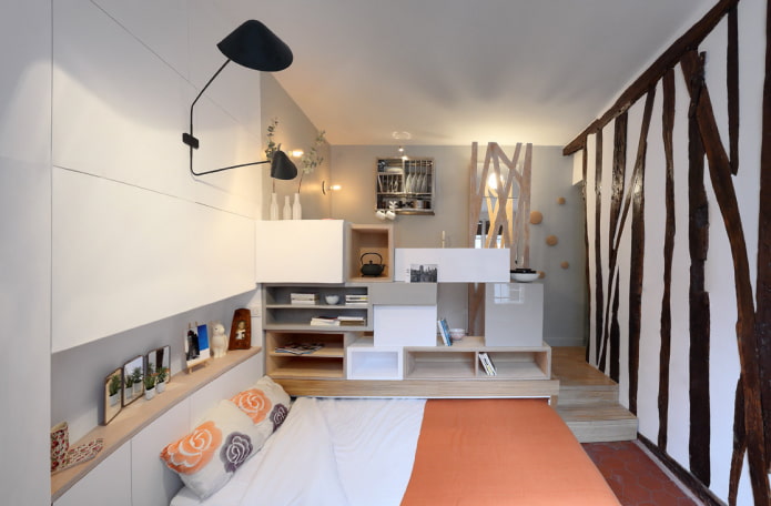 cama em um pódio no interior da cozinha