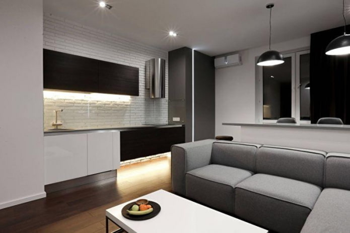 Sala de estar com cozinha e sofá