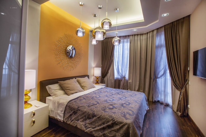 lustre acima da cama no interior do quarto