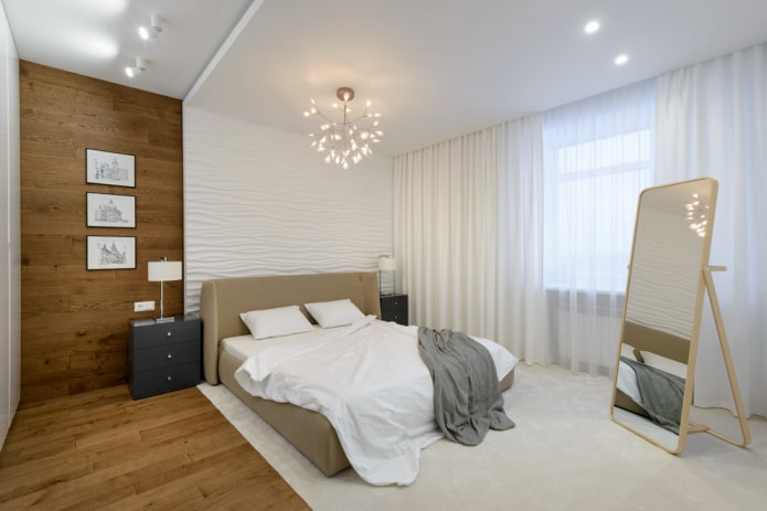 lustre acima da cama no interior do quarto