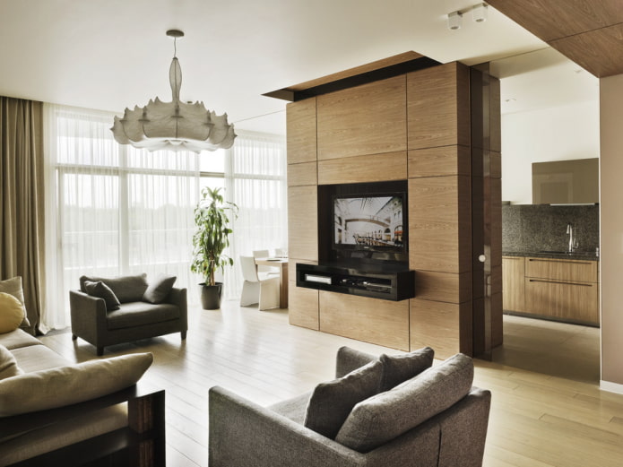 divisória com TV no interior da cozinha-sala de estar
