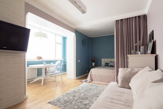 disposição do quarto combinada com uma sala de estar