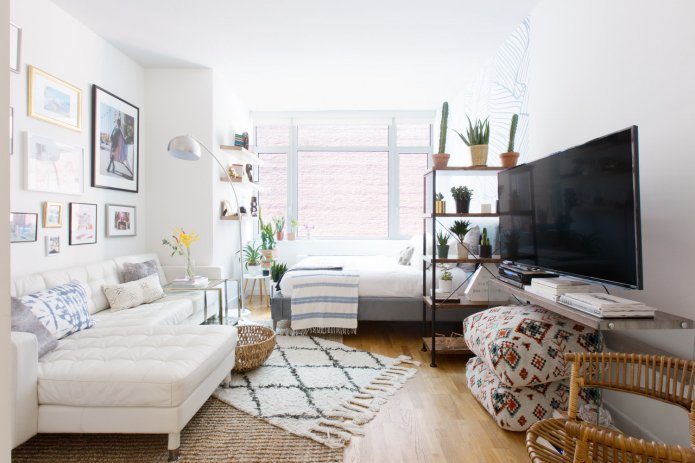 arranjo de um quarto e sala de estar combinados